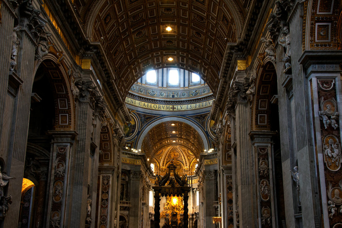 Gold interior on the wall, pillars and ceiling of St Peter's Basilica