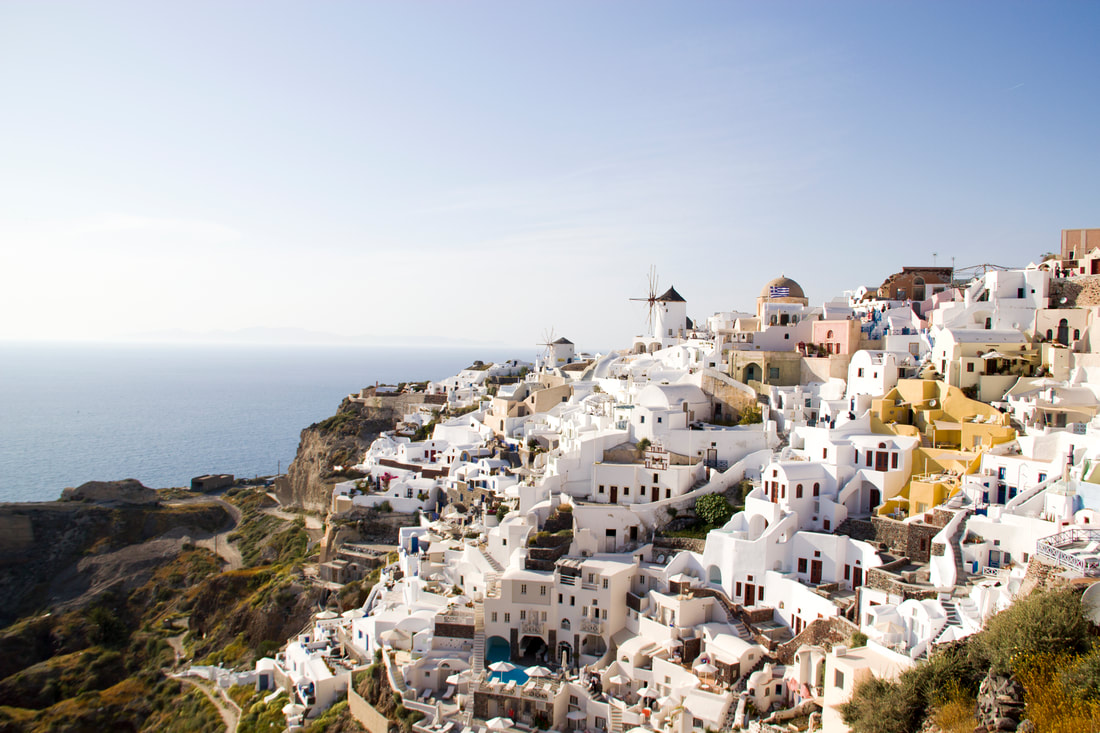 The buildings of the village sit on the mountain of Oia in Santorini. 