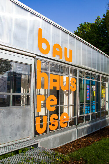 A building outside Bauhaus Archive in Berlin with Bauhaus on the window.