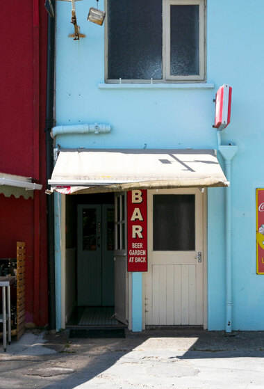 A bar with light blue wall