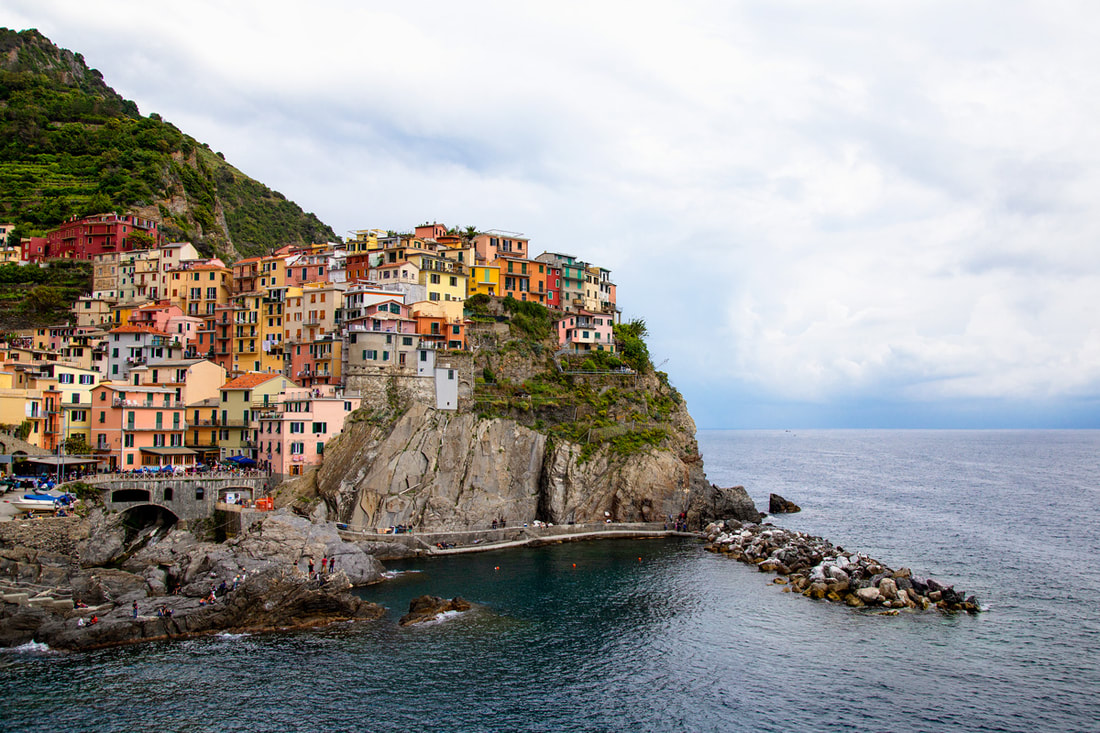 Colourful fisherman houses sit on the coast of Cinque Terre in Italy.